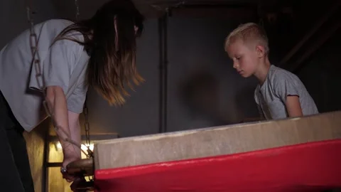 Children play in a large maze, roll a ball, completing a task in the quest room. Stock Footage 311154769