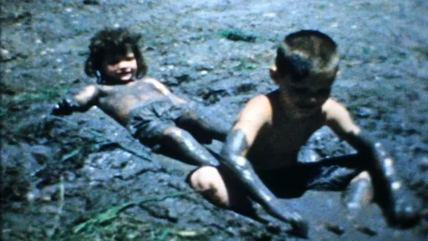 kids playing in the mud