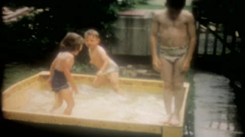 Children play in the new backyard pool 1950s vintage film home movie 3599 Stock Footage 67465337