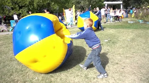 Children Play In Park With Zorb Bubbles Balls Stock Footage