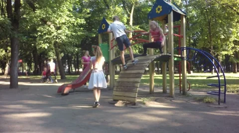 Children play on the playground having fun. Video stock 64807919
