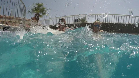Children play in the pool Stock Footage