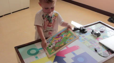 Children play with puzzle. Stock Footage 54293894