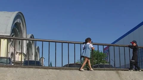 Children play on the railing of the bridge. Stock Footage 251953538