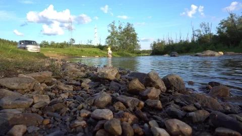 Children play by the river Stock Footage 111171201