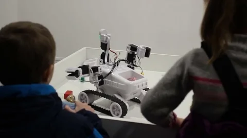 Children play with robot HD Stock Footage 71891052