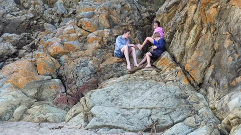 Children play on rocks Stock Footage 93042534