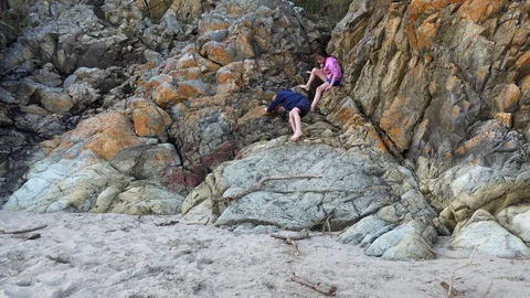 Children play on rocks Stock Footage 93043627