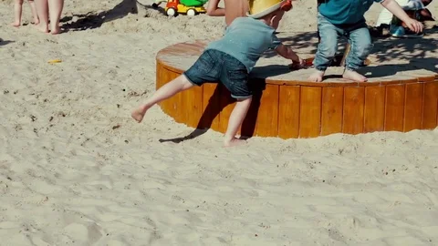 Children play in the sandbox in summer Stock Footage 77637818