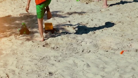 Children play in the sandbox in summer Stock Footage 77637963