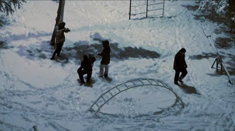 Children play in the snow at night Stock Footage