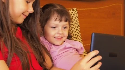 Children play on the tablet. Stock Footage