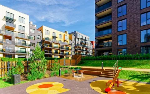 Children playground at Modern architectural complex of residential buildings Stock Photos