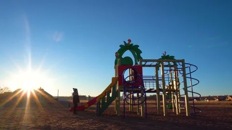 Children on the Playground at sunset 4K Stock Footage 99262689