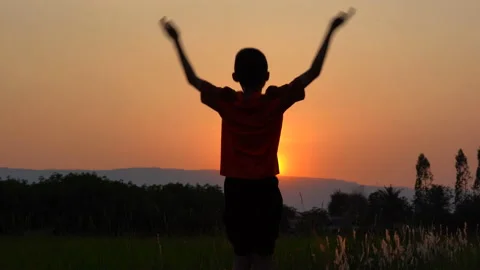 Children playing and exercise on sunrise background for joy and relax on field Vídeo Stock 150888891