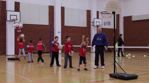 Children playing and learning basketball  in sports hall Stock Footage