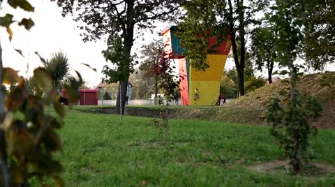 Children playing around climbing wall in the park Stock-Footage 42641189