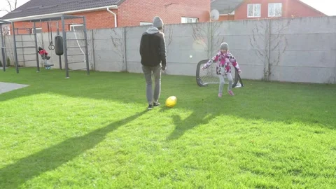 Children playing in the backyard with mother Stock Footage 143712696