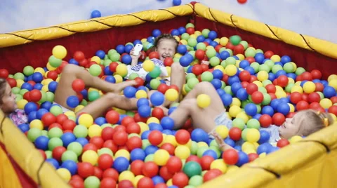 Children playing in ball pool Stock Footage 65657501