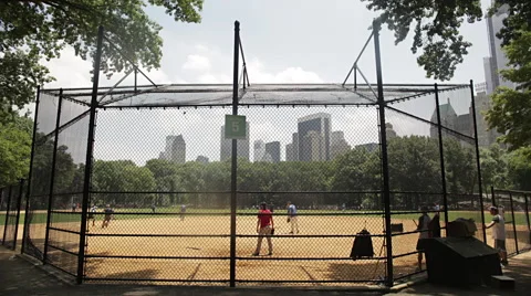 Children playing baseball on ground Stock-Footage 53776403