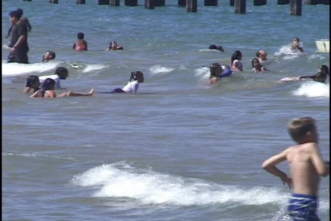 Children Playing on Beach 2 Stock Footage 297083