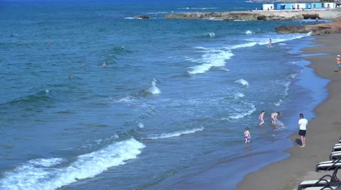 Children Playing On The Beach. 4K Video stock 64698706