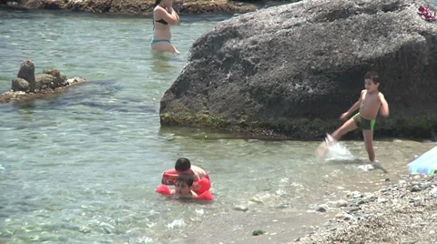 Children playing on beach. Stock Footage 30435016