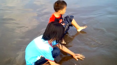 Children Playing on the Beach Stock Footage 40816392