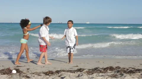 Children Playing at the Beach in Miami, doing Cartwheels Stock Footage 22232650
