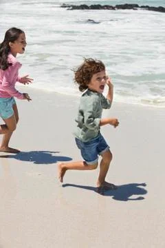 Children playing on the beach Stock Photos