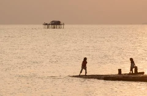 Children playing on the beach Stock Photos
