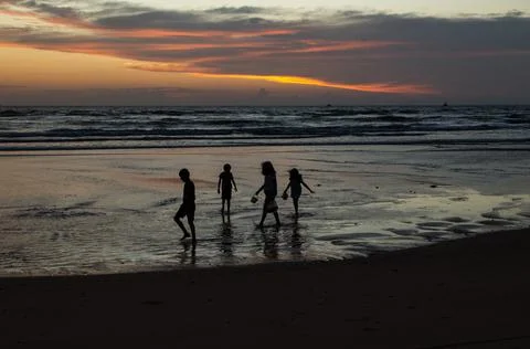 Children playing on the beach Stock Photos