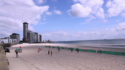 Children playing on the beach of a small Dutch town Vlissingen. Time lapse. Stock Footage 39778665