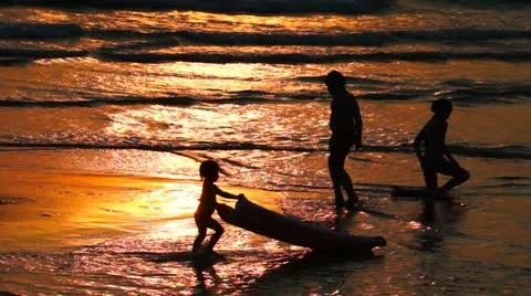 Children Playing on the Beach at Sunset Stock Footage 22013163
