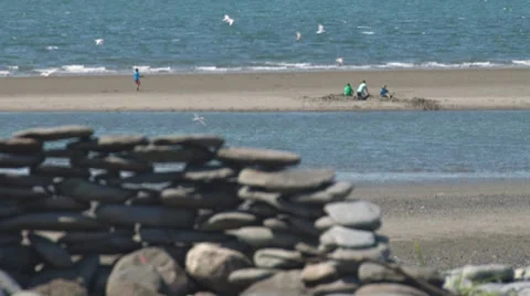 Children Playing on Beach tilt up 2 Stock Footage 8537178