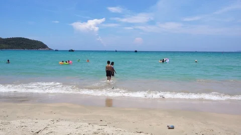 Children playing on the beach in vacation Stock Footage 90193442