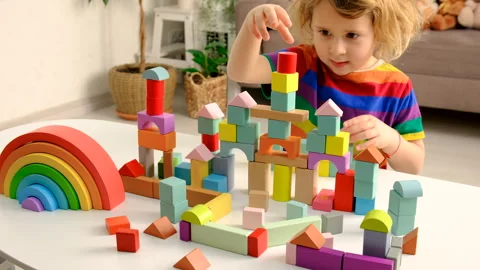 Children playing with blocks at home. Selective focus. Stock Footage 304213659