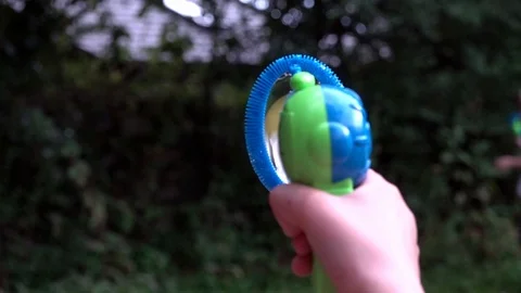 Children playing with bubbles Stock Footage 94408691