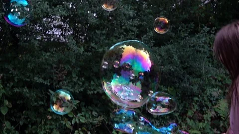 Children playing with bubbles Stock Footage 94408906