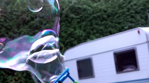 Children playing with bubbles Stock Footage 94409095