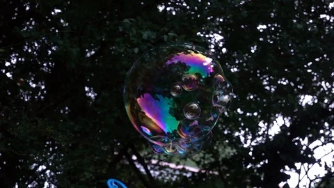 Children playing with bubbles Stock Footage 94409148