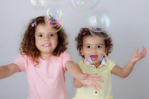 Children playing bubbles Stock Photos