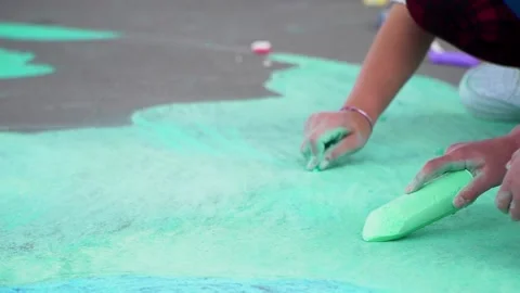 Children playing with crayons. Close up of a piece of chalk in a child's hand Stock Footage 218174395