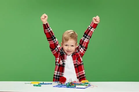 Children playing with electronic constructor at studio Stock Photos