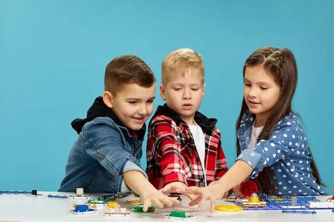 Children playing with electronic constructor at studio Stock Photos