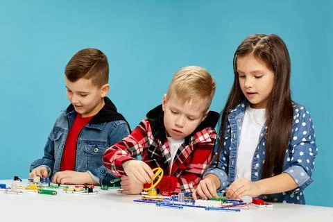 Children playing with electronic constructor at studio Stock Photos