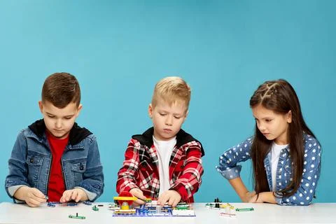 Children playing with electronic constructor at studio Stock Photos