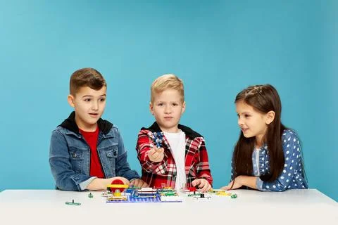 Children playing with electronic constructor at studio Stock Photos