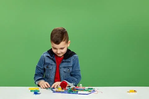 Children playing with electronic constructor at studio Stock Photos