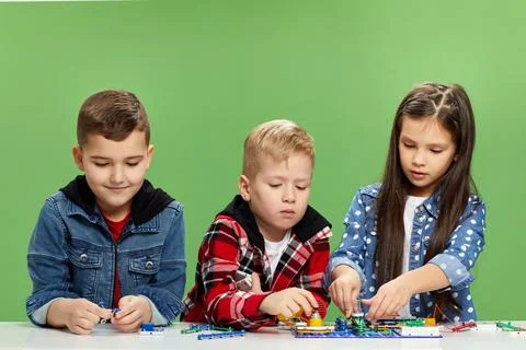 Children playing with electronic constructor at studio Stock Photos